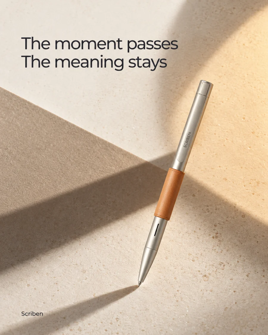 The moment passes. The meaning stays. A Scriben pen resting on sand.