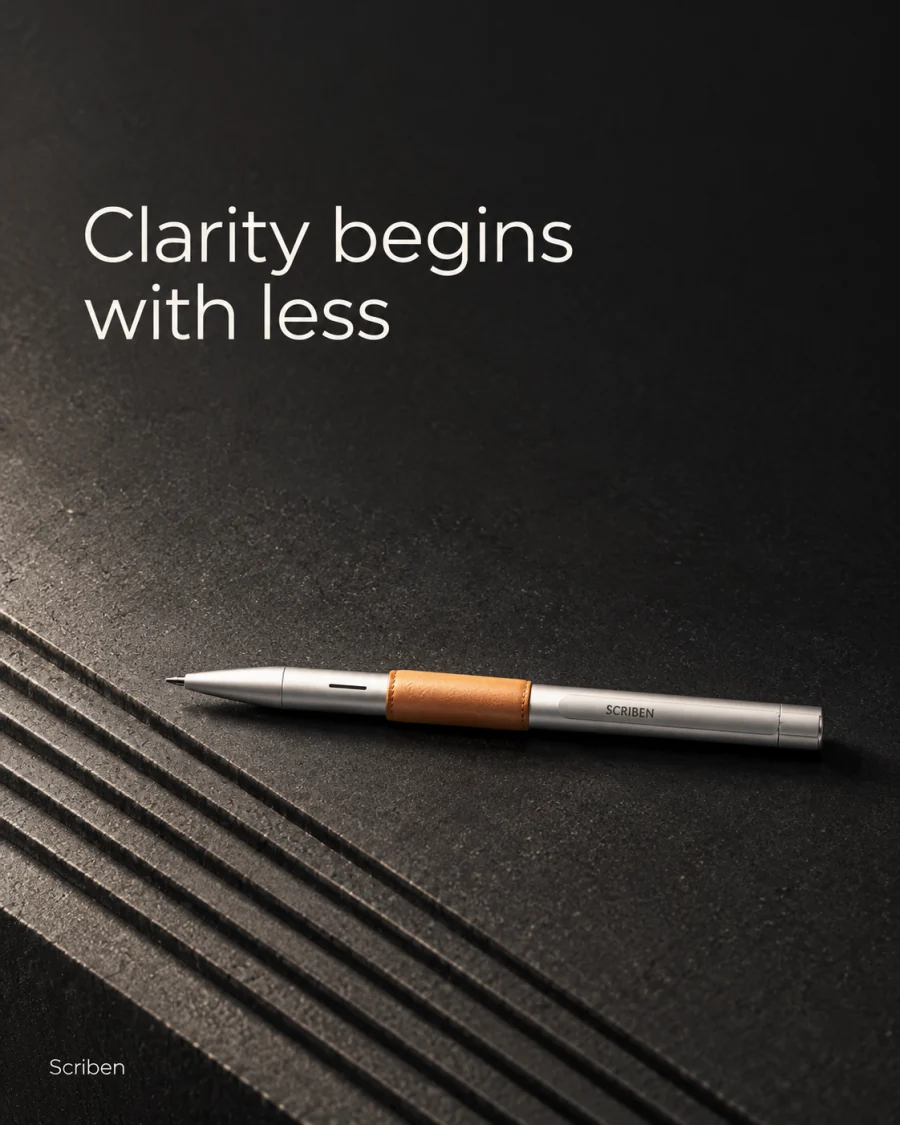 Clarity begins with less. A pen on a dark ribbed surface.