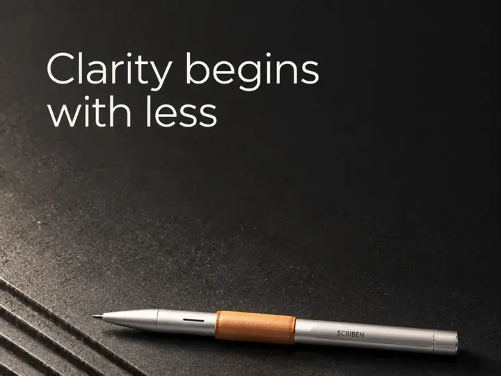 Clarity begins with less. A pen on a dark ribbed surface.