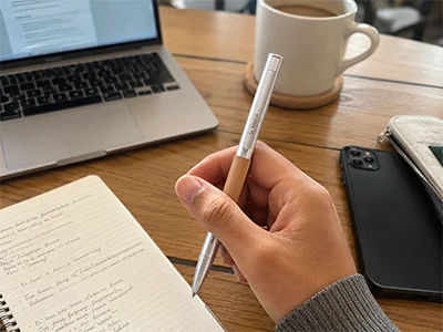 Scriben writing on paper